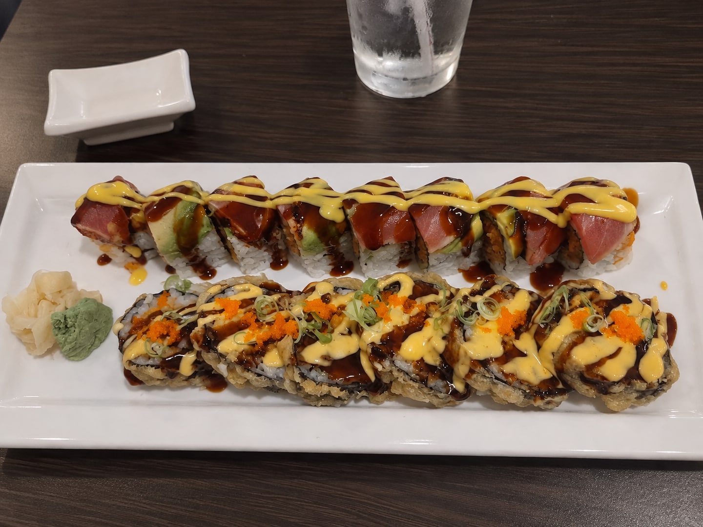 Two freshly prepared specialty sushi rolls at Red Plum